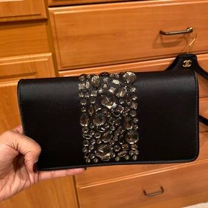 Black satin clutch with rhinestones.